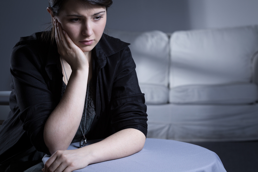 Portrait of young woman suffering from loneliness